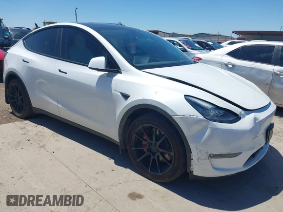 2022 Tesla Model Y Long Range z VIN 7SAYGDEE3NF426481, wystawiony jako IAAI lot #42076729 z przebiegiem 21 648 mil mil oraz . Historia ofert i sprzedaży dostępna na DreamBid. Obrazek 1.