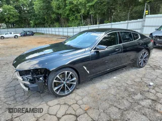 2020 BMW 8 Series 840i with VIN WBAGV2C02LCE04556, listed as a Copart auction lot 61073745 with 60,651 mi miles and Salvage title. Bid and sale history available at DreamBid. Image 1.