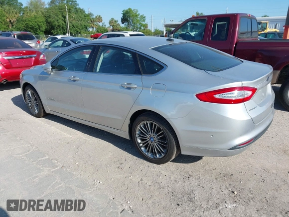 2013 Ford Fusion SE Hybrid with VIN 3FA6P0LU6DR127108, listed as a IAAI auction lot 42023529 with 250,057 mi miles. Bid and sale history available at carsss.com. Image 3.