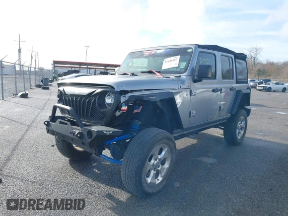 2020 Jeep Wrangler Unlimited Sport S with VIN 1C4HJXDG4LW221778, listed as a IAAI auction lot 41441662 with 76,026 mi miles and . Bid and sale history available at DreamBid. Image 2.