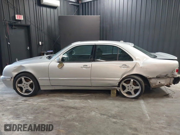 2002 Mercedes-Benz E-Class with VIN WDBJF82J52X062526, listed as a IAAI auction lot 41192641 with 126,352 mi miles. Bid and sale history available at carsss.com. Image 14.