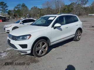 2016 Volkswagen Touareg Sport with VIN WVGEF9BP5GD012680, listed as a IAAI auction lot 41610943 with 153,952 mi miles and . Bid and sale history available at DreamBid. Image 2.