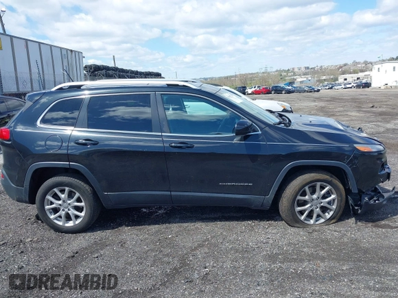 2014 Jeep Cherokee Latitude with VIN 1C4PJMCS8EW257959, listed as a IAAI auction lot 41987529 with 124,749 mi miles. Bid and sale history available at carsss.com. Image 14.
