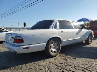 2001 Jaguar XJ VDP with VIN SAJDA24C11LF28715, listed as a Copart auction lot 65246334 with 107,965 mi miles and Salvage Title. Bid and sale history available at carsss.com. Image 3.