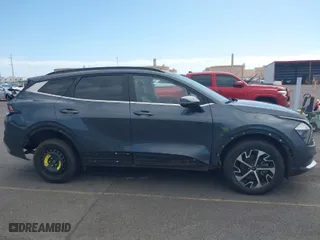 2023 Kia Sportage Hybrid EX with VIN KNDPVCAG5P7020209, listed as a IAAI auction lot 41409698 with 67,953 mi miles. Bid and sale history available at carsss.com. Image 6.