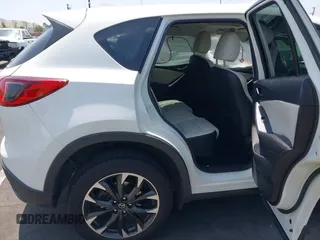 2016 Mazda CX-5 Grand Touring z VIN JM3KE2DY2G0824802, wystawiony jako IAAI lot #42170591 z przebiegiem 53 173 mil mil oraz . Historia ofert i sprzedaży dostępna na DreamBid. Obrazek 8.
