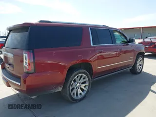 2020 GMC Yukon XL Denali with VIN 1GKS1HKJ3LR238701, listed as a IAAI auction lot 41724274 with 107,323 mi miles and . Bid and sale history available at DreamBid. Image 4.