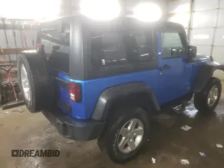 2015 Jeep Wrangler Willys Wheeler with VIN 1C4AJWAG2FL568130, listed as a Copart auction lot 80682914 with 111,686 mi miles and Salvage title. Bid and sale history available at DreamBid. Image 3.