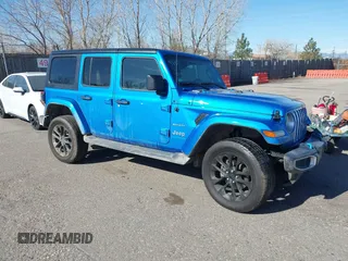 2023 Jeep Wrangler Sahara z VIN 1C4JJXP60PW513969, wystawiony jako IAAI lot #41766631 z przebiegiem 34 819 mil mil oraz . Historia ofert i sprzedaży dostępna na DreamBid. Obrazek 1.