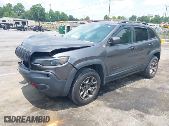 2020 Jeep Cherokee Trailhawk with VIN 1C4PJMBX5LD530720, listed as a IAAI auction lot 42404948 with 99,606 mi miles and . Bid and sale history available at DreamBid. Image 2.