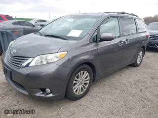 2012 Toyota Sienna XLE AAS with VIN 5TDYK3DC2CS276118, listed as a IAAI auction lot 41834422 with 143,043 mi miles. Bid and sale history available at carsss.com. Image 2.