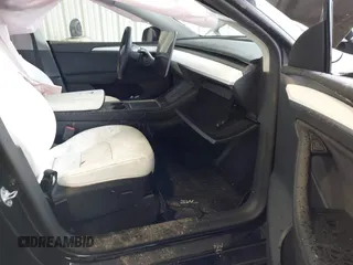 2023 Tesla Model Y Performance with VIN 7SAYGDEF2PF800641, listed as a IAAI auction lot 41612596 with 60,984 mi miles and . Bid and sale history available at DreamBid. Image 5.