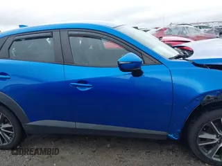 2017 Mazda CX-3 Touring z VIN JM1DKFC7XH0171860, wystawiony jako IAAI lot #42249818 z przebiegiem 54 873 mil mil oraz . Historia ofert i sprzedaży dostępna na DreamBid. Obrazek 13.