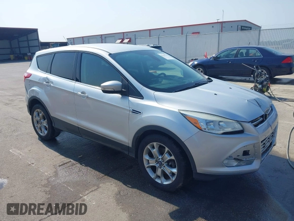 2013 Ford Escape SEL with VIN 1FMCU9H99DUA11243, listed as a IAAI auction lot 42356731 with 154,937 mi miles and . Bid and sale history available at DreamBid. Image 1.