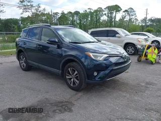 2018 Toyota RAV4 XLE with VIN JTMWFREV9JJ165655, listed as a IAAI auction lot 42138998 with 123,569 mi miles and . Bid and sale history available at carsss.com. Image 1.