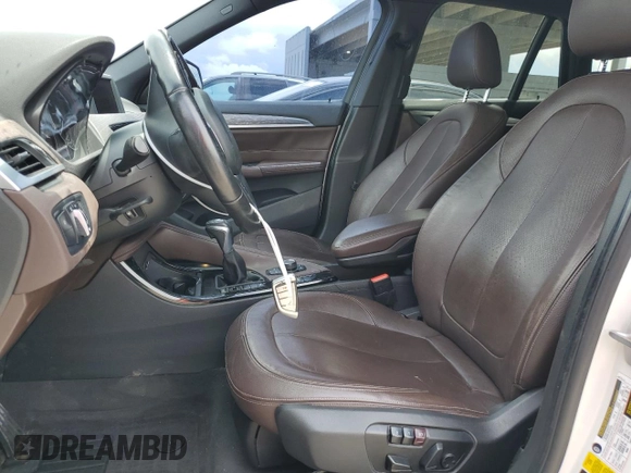 2016 BMW X1 xDrive28i with VIN WBXHT3C34GP887401, listed as a Copart auction lot 52255655 with 129,599 mi miles and Clean Title. Bid and sale history available at carsss.com. Image 7.