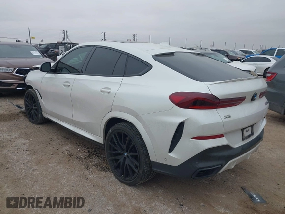 2021 BMW X6 M50i z VIN 5UXCY8C01M9E51506, wystawiony jako IAAI lot #41538726 z przebiegiem Nie podano mil oraz . Historia ofert i sprzedaży dostępna na DreamBid. Obrazek 3.
