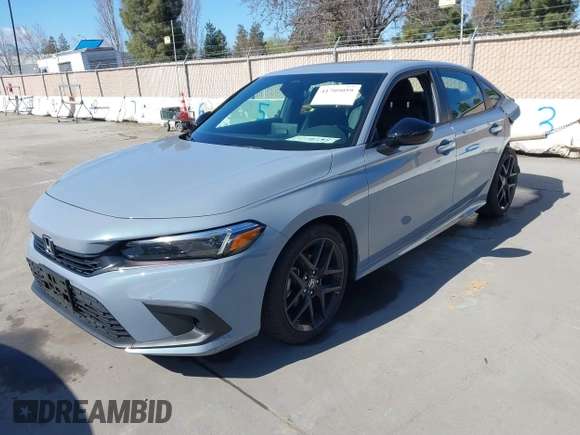 2022 Honda Civic Sport with VIN 2HGFE2F57NH600299, listed as a IAAI auction lot 41709059 with 9,060 mi miles and . Bid and sale history available at carsss.com. Image 2.