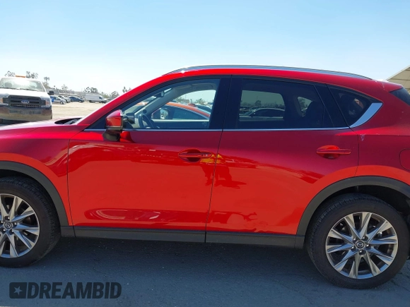 2021 Mazda CX-5 Grand Touring with VIN JM3KFADM5M0470483, listed as a IAAI auction lot 42785031 with 30,749 mi miles and . Bid and sale history available at DreamBid. Image 14.