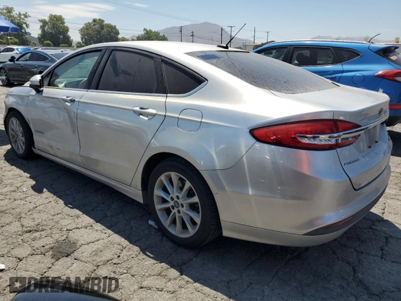 2017 Ford Fusion Hybrid SE z VIN 3FA6P0LU9HR306927, wystawiony jako Copart lot #63943395 z przebiegiem 157 851 mil mil oraz Czysty tytuł • Clean title. Historia ofert i sprzedaży dostępna na DreamBid. Obrazek 2.
