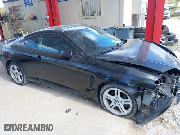 2006 Hyundai Tiburon GT z VIN KMHHN65F56U224768, wystawiony jako IAAI lot #40672721 z przebiegiem 158 535 mil mil oraz . Historia ofert i sprzedaży dostępna na DreamBid. Obrazek 14.
