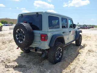 2024 Jeep Wrangler Rubicon with VIN 1C4PJXFG3RW295565, listed as a IAAI auction lot 42026211 with 5,661 mi miles. Bid and sale history available at carsss.com. Image 4.
