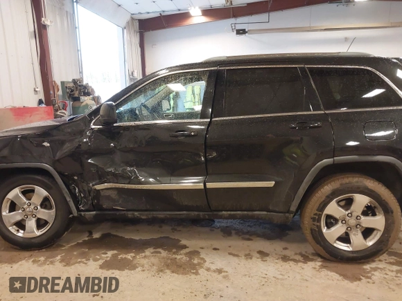2012 Jeep Grand Cherokee Laredo with VIN 1C4RJFAT1CC225479, listed as a IAAI auction lot 41709911 with 227,150 mi miles. Bid and sale history available at carsss.com. Image 14.