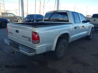 2003 Dodge Dakota SLT with VIN 1D7HL48N13S294573, listed as a IAAI auction lot 41291127 with 227,355 mi miles. Bid and sale history available at carsss.com. Image 4.