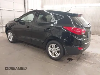 2013 Hyundai Tucson GLS with VIN KM8JU3AC8DU557445, listed as a IAAI auction lot 41839782 with 153,769 mi miles. Bid and sale history available at carsss.com. Image 3.