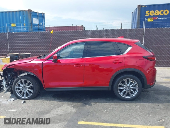 2021 Mazda CX-5 Grand Touring with VIN JM3KFADM6M1373111, listed as a IAAI auction lot 42784431 with 14,374 mi miles and . Bid and sale history available at DreamBid. Image 14.