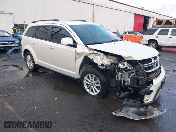 2014 Dodge Journey SXT with VIN 3C4PDCBGXET182430, listed as a IAAI auction lot 41599489 with 143,889 mi miles. Bid and sale history available at carsss.com. Image 1.