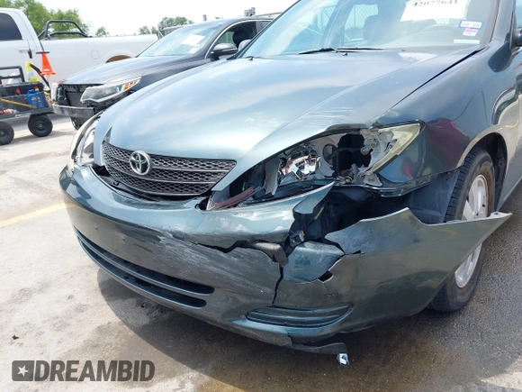 2002 Toyota Camry LE z VIN 4T1BE30KX2U591037, wystawiony jako IAAI lot #42077641 z przebiegiem 86 569 mil mil oraz . Historia ofert i sprzedaży dostępna na DreamBid. Obrazek 6.