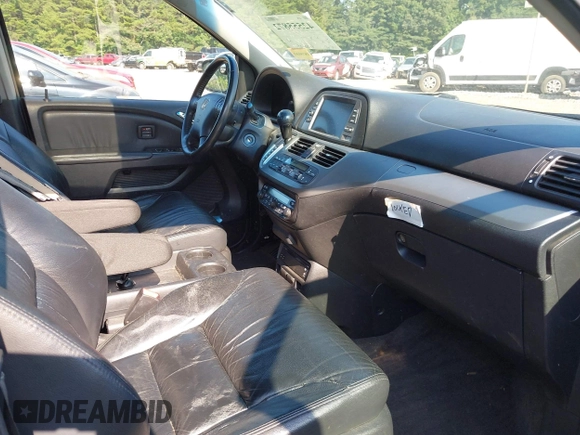 2010 Honda Odyssey Touring with VIN 5FNRL3H97AB104359, listed as a IAAI auction lot 42555872 with 233,952 mi miles and . Bid and sale history available at DreamBid. Image 5.