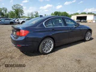 2015 BMW 3 Series 328i xDrive with VIN WBA3B5G50FNS16915, listed as a Copart auction lot 61603915 with 137,059 mi miles and Salvage title. Bid and sale history available at DreamBid. Image 3.