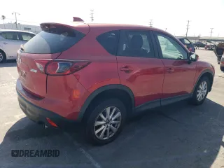 2014 Mazda CX-5 Touring with VIN JM3KE2CY9E0356050, listed as a Copart auction lot 65470674 with 70,400 mi miles and Salvage Title. Bid and sale history available at DreamBid. Image 3.