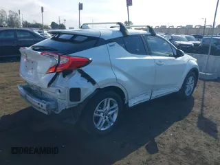 2020 Toyota C-HR LE with VIN JTNKHMBX6L1076433, listed as a IAAI auction lot 40975841 with 20,687 mi miles. Bid and sale history available at carsss.com. Image 4.