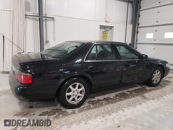 2002 Cadillac Seville Touring STS z VIN 1G6KY54962U158476, wystawiony jako Copart lot #86624774 z przebiegiem 77 818 mil mil oraz Szkoda całkowita • Salvage title. Historia ofert i sprzedaży dostępna na DreamBid. Obrazek 3.