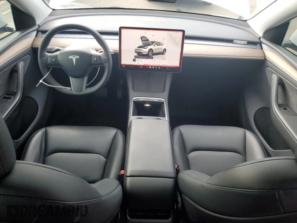 2023 Tesla Model Y Long Range with VIN 7SAYGDEE3PA130988, listed as a Copart auction lot 42172185 with 112,136 mi miles and Salvage Title. Bid and sale history available at DreamBid. Image 8.