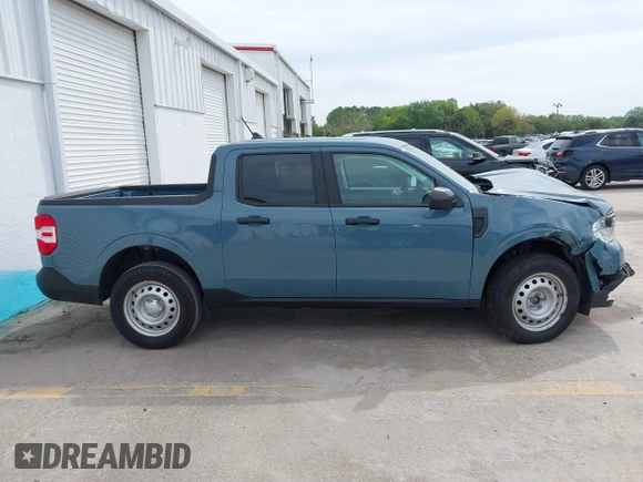 2023 Ford Maverick XL z VIN 3FTTW8E37PRA74216, wystawiony jako IAAI lot #41852290 z przebiegiem 21 849 mil mil oraz . Historia ofert i sprzedaży dostępna na DreamBid. Obrazek 14.