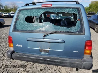 1999 Jeep Cherokee Sport with VIN 1J4FT68S1XL577603, listed as a Copart auction lot 54216115 with 180,128 mi miles and Salvage title. Bid and sale history available at DreamBid. Image 6.
