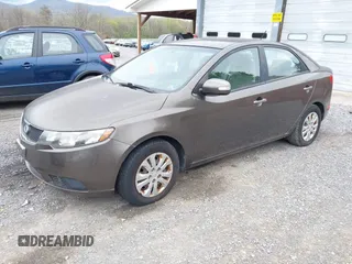 2010 Kia Forte EX with VIN KNAFU4A23A5847814, listed as a IAAI auction lot 42048432 with 97,678 mi miles. Bid and sale history available at carsss.com. Image 2.