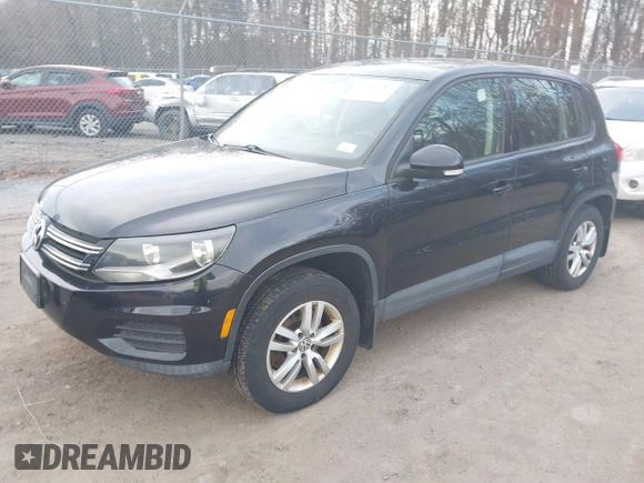 2013 Volkswagen Tiguan S with VIN WVGAV3AX4DW572884, listed as a IAAI auction lot 41626981 with 243,188 mi miles and . Bid and sale history available at DreamBid. Image 2.