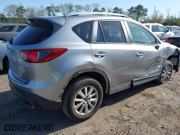 2014 Mazda CX-5 Touring with VIN JM3KE4CY0E0302583, listed as a IAAI auction lot 41947735 with 122,077 mi miles. Bid and sale history available at carsss.com. Image 4.
