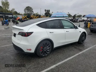 2023 Tesla Model Y Performance with VIN 7SAYGDEF1PF809654, listed as a Copart auction lot 43981915 with 16,401 mi miles and Salvage Title. Bid and sale history available at DreamBid. Image 3.