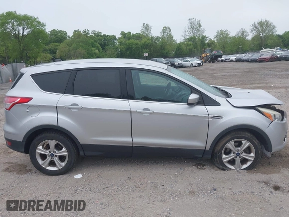 2015 Ford Escape SE z VIN 1FMCU0G73FUB10414, wystawiony jako IAAI lot #42173063 z przebiegiem 120 200 mil mil oraz . Historia ofert i sprzedaży dostępna na DreamBid. Obrazek 14.