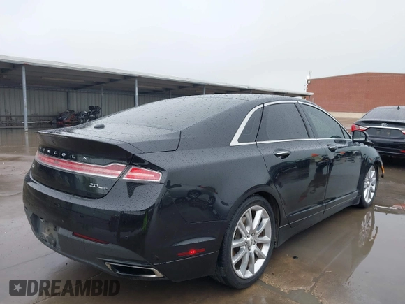 2015 Lincoln MKZ z VIN 3LN6L2G90FR621891, wystawiony jako IAAI lot #41968088 z przebiegiem 128 988 mil mil oraz . Historia ofert i sprzedaży dostępna na DreamBid. Obrazek 4.