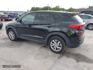 2019 Hyundai Tucson SE with VIN KM8J23A40KU874423, listed as a IAAI auction lot 41858253 with 136,651 mi miles. Bid and sale history available at carsss.com. Image 3.