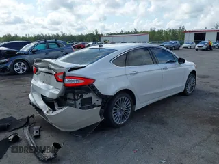 2016 Ford Fusion Titanium with VIN 3FA6P0K96GR400436, listed as a IAAI auction lot 42191256 with 128,447 mi miles and . Bid and sale history available at DreamBid. Image 4.
