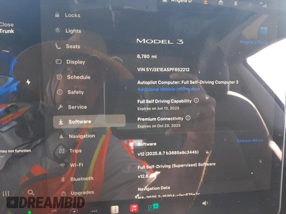 2023 Tesla Model 3 with VIN 5YJ3E1EA5PF652212, listed as a Copart auction lot 57348395 with 8,780 mi miles and Salvage title. Bid and sale history available at DreamBid. Image 9.