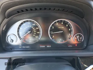 2013 BMW 7 Series 750i with VIN WBAYA8C54DC996412, listed as a Copart auction lot 56982895 with 124,258 mi miles and Salvage title. Bid and sale history available at DreamBid. Image 9.